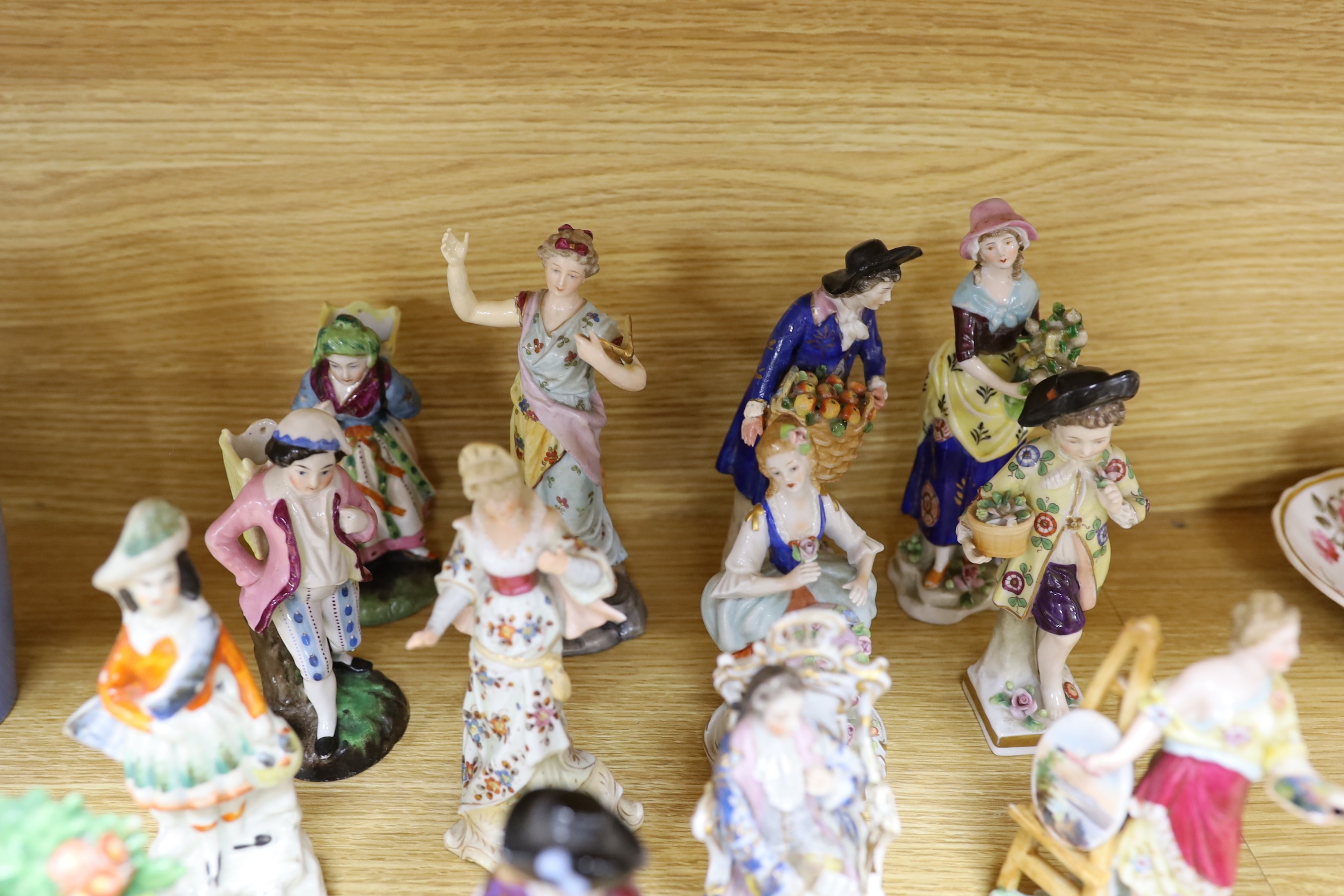 A group of small continental porcelain figures, to include Dresden and others